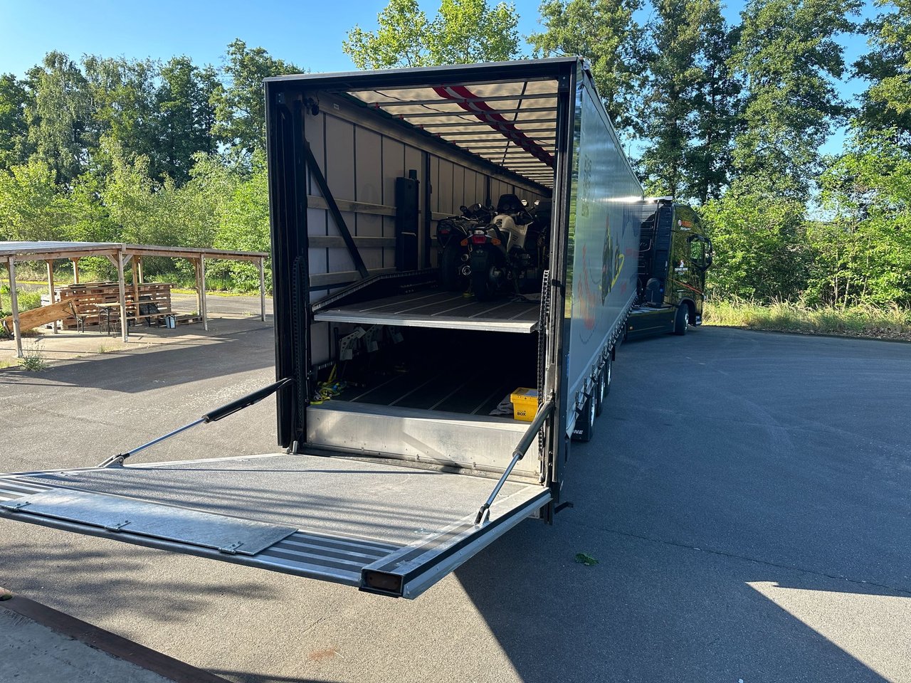 GlobalMotoParts warehouse — purchased motorcycles ready for processing