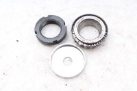 Ohjauspään laakerin aluslevyjen haarukkasilta...