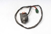 Ohjaustangon kytkimen ohjaustangon kiinnitys oikealla...