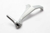 Matkustajan jalkatuen pidike takana oikealla...