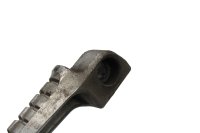 Voetsteun voor de passagier linksachter, compleet met veerbevestiging. Kawasaki ZX-7R ZX750N 96-99